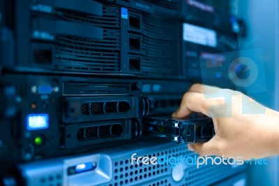 Man Fix Server Network In Data Center Room Stock Photo