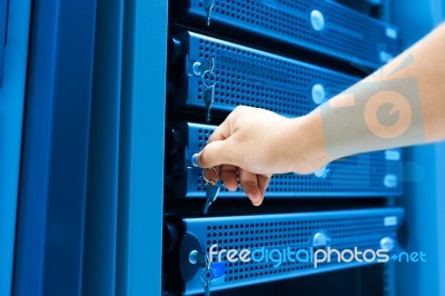 Man Fix Server Network In Data Center Room Stock Photo