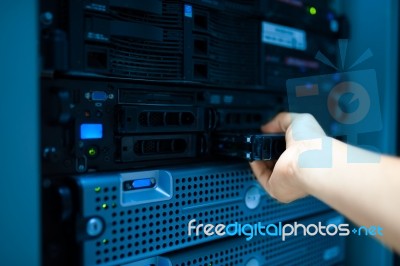 Man Fix Server Network In Data Center Room Stock Photo