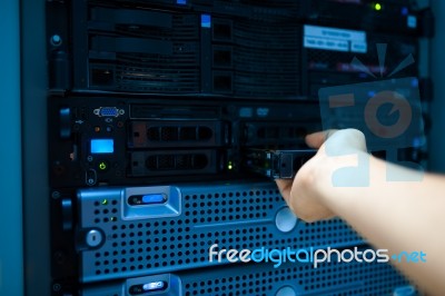 Man Fix Server Network In Data Center Room Stock Photo