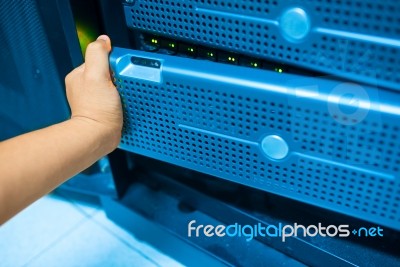 Man Fix Server Network In Data Center Room Stock Photo