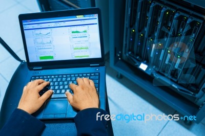 Man Fix Server Network In Data Center Room Stock Photo