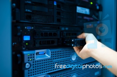 Man Fix Server Network In Data Center Room Stock Photo