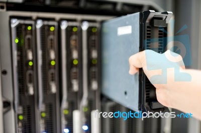 Man Fix Server Network In Data Center Room Stock Photo