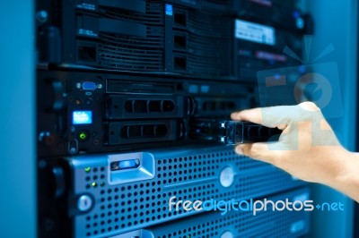 Man Fix Server Network In Data Center Room Stock Photo