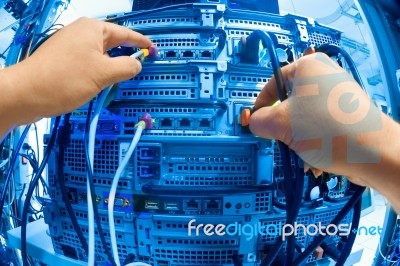 Man Fix Server Network In Data Center Room Stock Photo