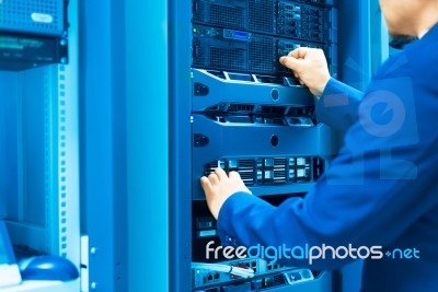 Man Fix Server Network In Data Center Room Stock Photo