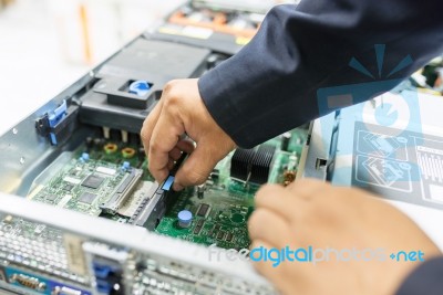 Man Fix Server Network In Data Center Room Stock Photo