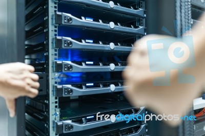 Man Fix Server Network In Data Center Room Stock Photo