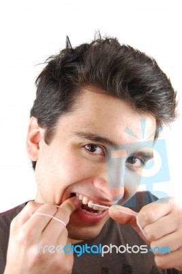 Man Flossing His Teeth Stock Photo