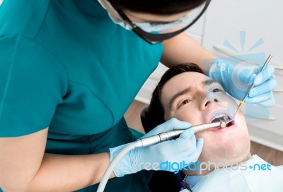 Man Getting A Dental Checkup Stock Photo