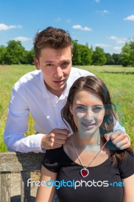 Man Giving Heart Necklace To Young Attractive Woman Stock Photo