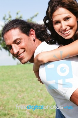 Man Giving Piggyback Ride Stock Photo