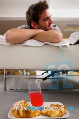 Man Having Breakfast In Bed Stock Photo