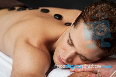 Man Having Massage At Spa Stock Photo