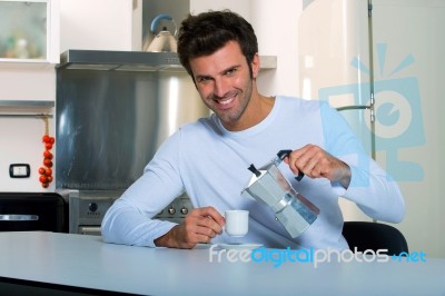 Man Having Tea In Kitchen Stock Photo