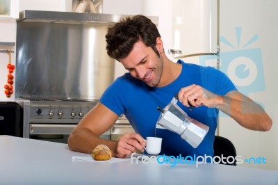 Man Having Tea In Kitchen Stock Photo