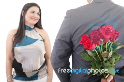 Man Hiding Bunch Of Red Roses Behind His Back To Surprise His Gi… Stock Photo