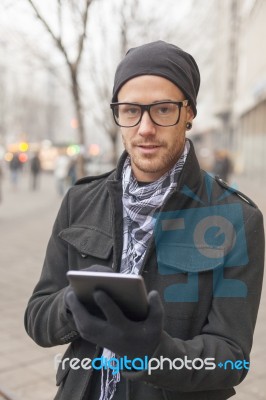 Man Holdin I-pad Tablet Computer On Street Stock Photo