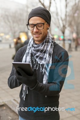 Man Holdin I-pad Tablet Computer On Street Stock Photo