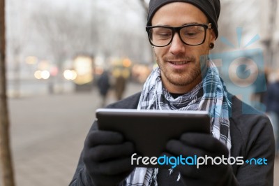 Man Holdin I-pad Tablet Computer On Street Stock Photo