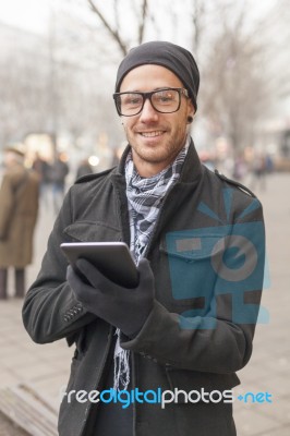 Man Holdin I-pad Tablet Computer On Street Stock Photo