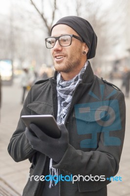 Man Holdin I-pad Tablet Computer On Street Stock Photo