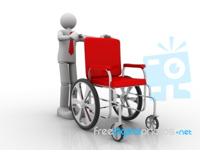 Man Holding A Wheelchair Stock Image