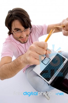 Man Holding Pencil With Laptop Stock Photo