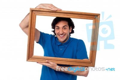 Man Holding Wooden Picture Frame Stock Photo