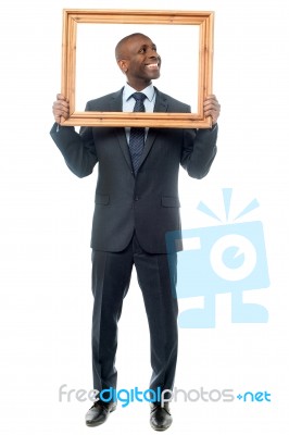 Man Holding Wooden Picture Frame Stock Photo