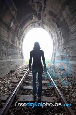 Man In A Tunnel Looking Towards The Light Stock Photo