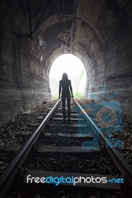 Man In A Tunnel Looking Towards The Light Stock Photo