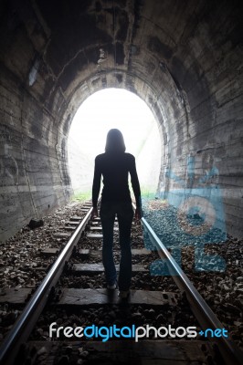 Man In A Tunnel Looking Towards The Light Stock Photo