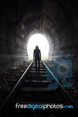 Man In A Tunnel Looking Towards The Light Stock Photo