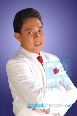 Man In A White Tuxedo Stock Photo