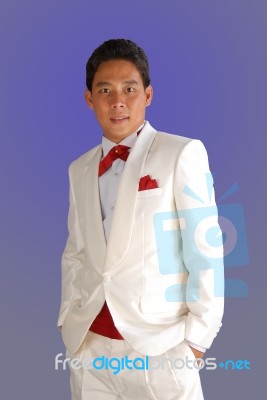 Man In A White Tuxedo Stock Photo