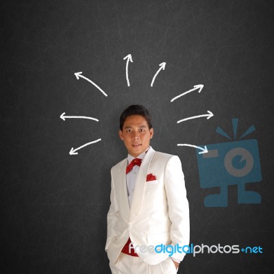 Man In A White Tuxedo Stock Photo