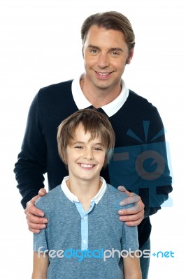 Man In Blue Pullover Posing With His Son Stock Photo