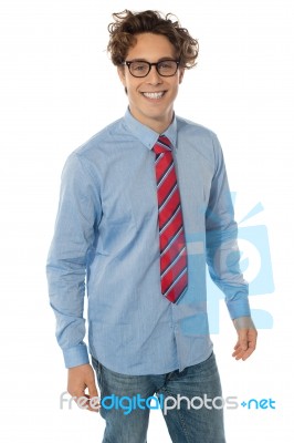 Man In Blue Shirt, Jeans And Tie Stock Photo