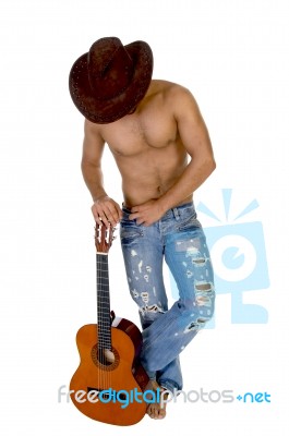 Man In Cowboy Hat Holding Guitar Stock Photo