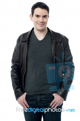 Man In Leather Jacket Posing Over White Stock Photo