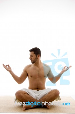 Man In Yoga Pose Stock Photo