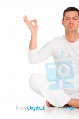 Man Is Practicing Yoga Stock Photo