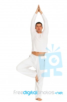 Man Is Practicing Yoga Stock Photo