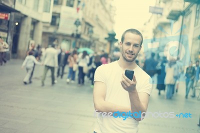 Man Joy With Cell Phone In City Stock Photo