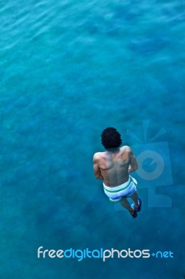 Man Jumping In Water Stock Photo