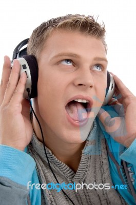 Man Listening Through Headphone Stock Photo