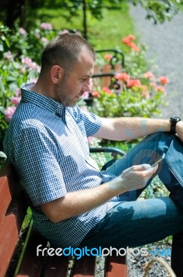 Man Looking At Smartphone Stock Photo