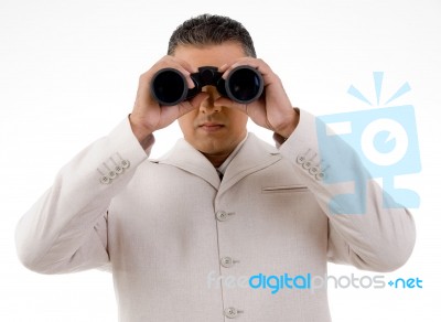 Man Looking Through Binocular Stock Photo